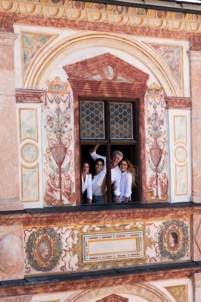 Goëss-Enzenberg family at a painted Renaissance window of Schloss Tratzberg in Tyrol